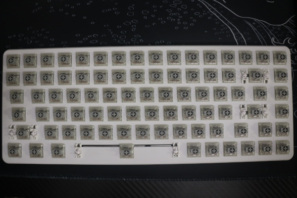 Keyboard exposing all grey colored Gateron blue switches.